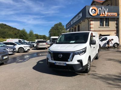 a white van that is parked in front of a building