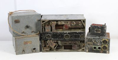 three old radio ' s that are sitting next to each other