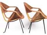 pair of vintage wicker chairs with metal legs and arms