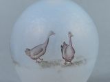 a picture of a vase with two birds painted on it