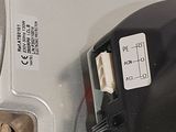 a close up of a computer mouse with a yellow cord