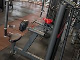 a gym with a lot of machines in the room