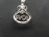 a silver heart shaped pendant with the word love on it