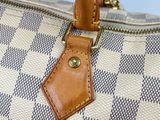 a close up of a purse with a tag on it