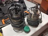 two water pumps sitting on top of a white counter