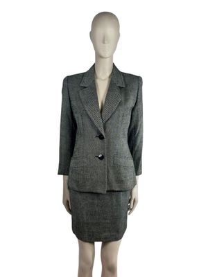 an image of a mannequin wearing a suit and skirt