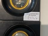 pair of miniature portraits of a lady and a gentleman in black and gold frames