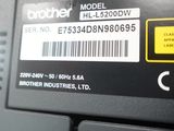 a label on the back of a laptop that reads brother hl - 5330dw