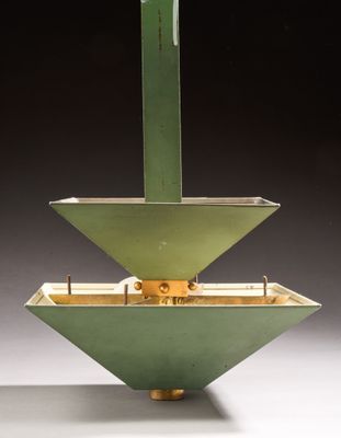 a green object that is sitting in the middle of a table