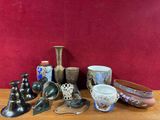 many different types of vases sitting on a table