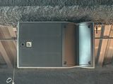 a metal box that is open and sitting on the floor