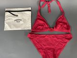 a red bikinisuit with a drawstring and a drawstring bag