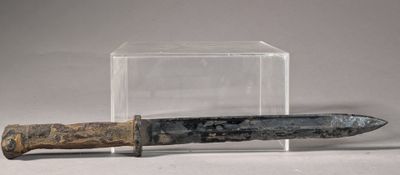an old knife with a wooden handle in a clear box