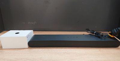 an image of a box with headphones and a speaker on a table
