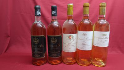six bottles of wine are lined up in a row on a pink background