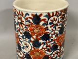 a cup with a floral design on it