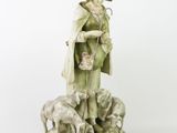 figurine of a boy with sheep and sheepdogs on a white background