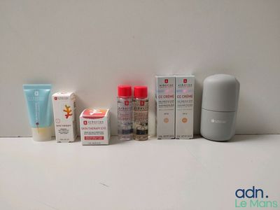 many different types of skin care products displayed on a table