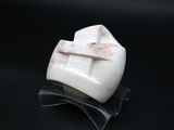 a white marble sculpture with a cross on top of it