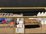 a cart with a lot of bottles and other items on it