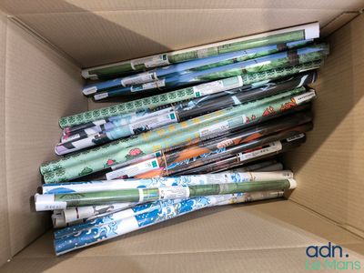 many rolls of wrapping paper in a cardboard box