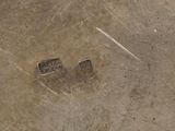 a picture of a dirty floor with a sign on it