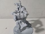 a miniature model of a man with a gun in his hand