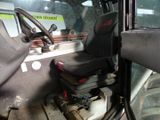 an image of a truck with a seat and steering wheel