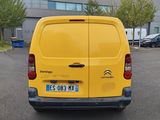 a yellow van that is parked in a parking lot