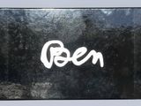 a picture of a black box with the word green written on it