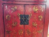 an image of a red cabinet sitting on top of a hard wood floor
