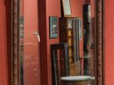 a mirror hanging on the wall in a room