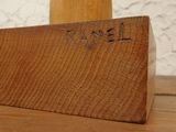 a wooden block that has a name engraved on it