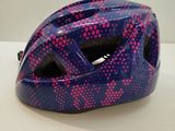 a blue helmet with pink dots on it on a white surface
