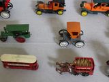 a lot of toy cars and trucks on a table