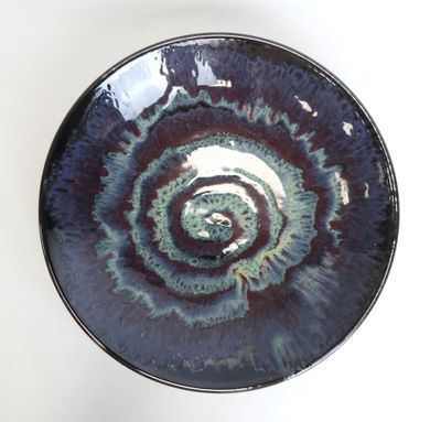 a blue and purple bowl with a spiral design on it
