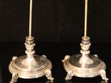 pair of antique silver plated candlesticks with lion heads