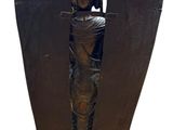 a statue of a man on a cross on a pedestal