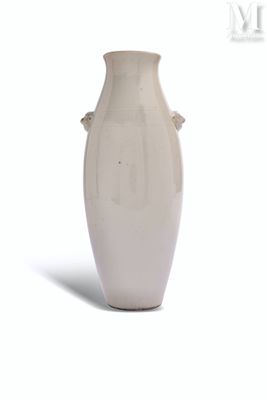 a white vase that is sitting on a white surface