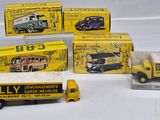 a lot of toy trucks that are sitting on a table