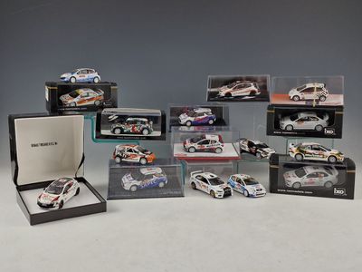 many different models of cars in a display case