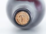a close up of a wine bottle with a cork in it