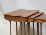 pair of wooden tables with turned legs on a white background