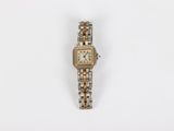 an image of a woman ' s wrist watch on a white surface