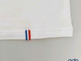 a white t - shirt with a red, white, and blue stripe on it