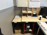 a desk with a computer and a monitor on it