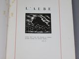 an open book with a picture of a cloud in the sky
