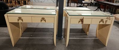 pair of art deco side tables with glass tops and brass hardware