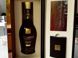 a bottle of brandy in a wooden case
