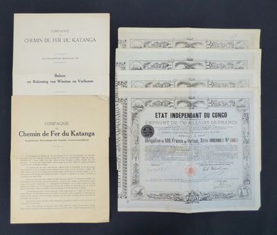 two old documents are sitting on a table next to each other